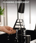 Washing the removable brew basket of a 10 Cup Programmable Coffee Maker With Regular And Strong Brew Auto Shut Off Permanent Filter.