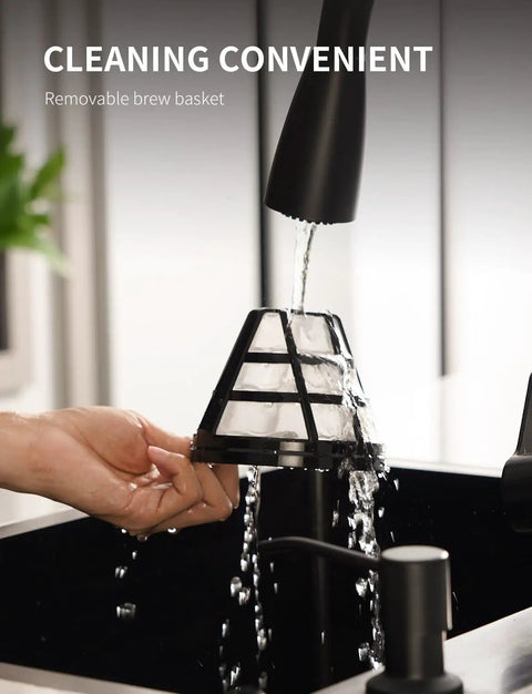 Washing the removable brew basket of a 10 Cup Programmable Coffee Maker With Regular And Strong Brew Auto Shut Off Permanent Filter.