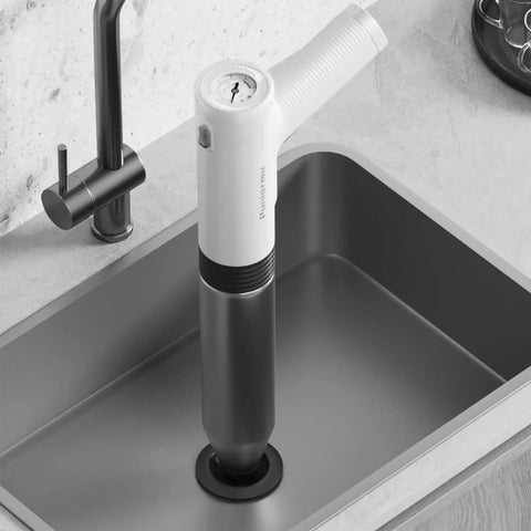 Heavy Duty Electric Toilet Plunger That Cracks Open Stubborn Clogs Fast, High Pressure Air Jet Drain Opener in kitchen sink.