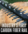 Close-up of cordless hedge trimmer 26 inch with carbon fiber rail and dual action steel blades on wood