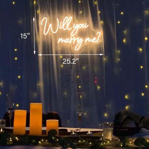 Will You Marry Me Neon Sign For Proposals And Weddings, 25 By 15 Inches, Warm White LED Lights above a romantic dining setup