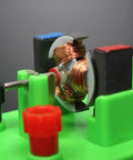 Close-up of copper wound DC motor model in Hands On Circuit And Motor Lab Kit For Students DIY STEM projects, mounted on green base.