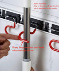 Space Saving Stainless Steel Wall Mount Mop And Broom Holder With S Type Grippers No Fuss Anti Slip Mop Rack in use