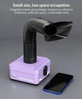 Game Changing Desktop Soldering Smoke Absorber With Heavy Duty Carbon Filter And High Suction Fume Extractor in purple, compact design next to smartphone.