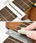 Guitar Luthier Tool Kit Pro Grade with fingerboard guard and sanding paper used on a guitar neck for fret maintenance