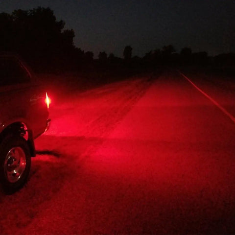 Car at night with Red 3156 3157 LED Turn Signal Bulbs for T25 Set of 2 Hella Bright Back Up Reverse Brake Tail Lights illuminating the road