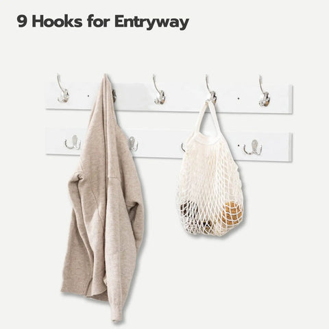 White wall-mounted coat rack with 9 hooks holding a beige sweater and a mesh bag, part of Shoe Storage Bench With Cushion 39 Inch Entryway Bench.