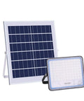Hella Bright 200 Watt Solar Flood Light With Integrated Remote And Badass IP67 Waterproof Shell next to solar panel.