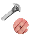 Close-up of silver iron brad in hand from 100 Pcs Iron Brads For DIY Crafting And Puppet Making Kit Durable Metal Fasteners For Paper Embellishments And Shadow Puppets Great For Creative Projects For All You Crafty Folks And Scrapbookers
