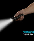 Hand holding PowerSwitch Dual Color LED Flashlight With Rechargeable Battery And Dual Power Sources for quick light switching