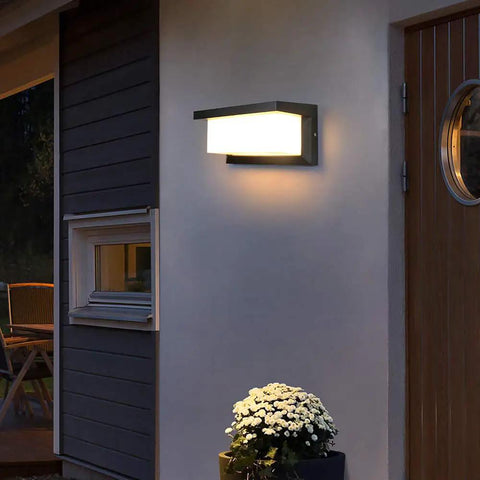 Outdoor Wall Porch Light LED Matte Black Exterior Lamp illuminating a porch, IP65 Waterproof, energy-efficient, 3-color temperature options.