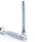 Two M7 X 50mm Confirmat Screws showing flat head hex drive, 3.25mm pitch, countersunk design, for wood furniture assembly.