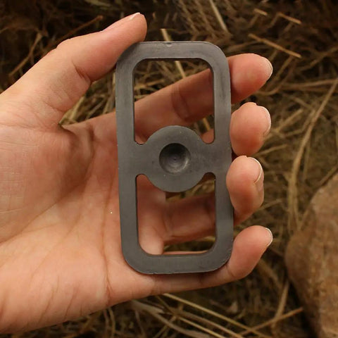 Hand holding Tough As Nails Fire Starter Tool For Camping And Hiking, Carbon Steel Fire Striker Without Stone, Quick Spark Emergency Flint