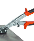 NR1 Hand Nibbler with Built-In Waste Cutter cutting flat metal sheet, soft grip handles, clean burr-free edges, protective guard shown