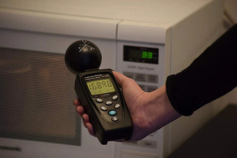 Person using HF B3G Triple Axis RF Analyzer For Home EMF Inspections Detects Emissions From Cell Phones, Cell Towers, Smart Meters, WiFi, Bluetooth And Microwave Sources With Precise uW/cm2 Readings, Beginner Friendly Setup, Free Support near microwave