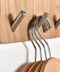 Heavy Duty Solid Wood Wall Mounted Coat Rack With Reinforced Metal Hooks showcasing hooks with wooden coasters organized.