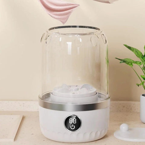 Portable Mini Washer Ultra Compact Wash Tub For Underwear And Socks Hella Quick Stain Removal Ultra Silent Operation on countertop.