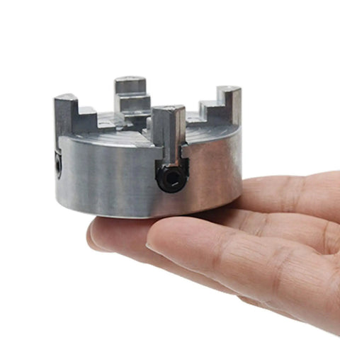 4 Jaw Lathe Chuck For Mini Wood Lathe shown in hand, high precision, carbon steel, self-centering for mini wood turning