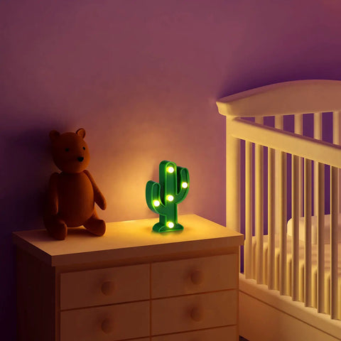 2 Pcs LED Night Light Cactus Lamp Set For Table Desk Bedroom And Home Decor, Cute Mexican Cinco De Mayo Party Decorations, Cozy Glow For Living Room, 4.72 By 2.76 Inch shown on a nursery table beside a teddy bear