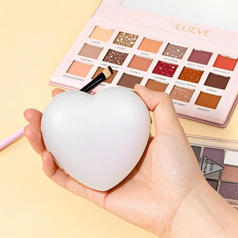 Person holding E Heart Shaped White Palette, part of Two Pack Resin Nail Art Palette With Gold Edge Mixing Tray For Nail Polish.