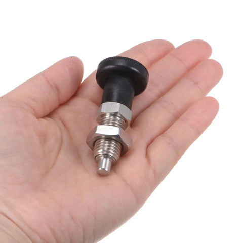 Built Different Stainless Steel Push Fit Ball Nose Spring Plunger M12x1.5 Thread With 6mm Pin held in hand for quick installation.