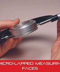 Hand holding Workhorse Digital Micrometer with One-Piece Spindle and Tapered Frame for Tight Slots, satin chrome finish, side view