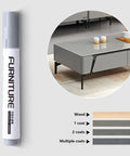 12 Color Wood Marker Set For Furniture Repair pen shown next to coatings on wood surface with table in background illustrating use