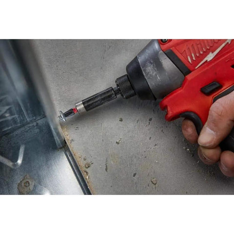 Using Shockwave Impact Duty Driver Bit Set 70 Piece With Shockzone Geometry on metal surface with dirt.