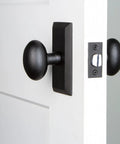 Vale Short Plate With Aeg Knob In Black Iron For Modern Door Hardware Upgrades Sleek Rosette Alternative That Elevates Interiors