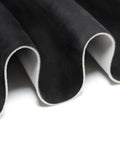Suede headliner fabric with foam backing in black; close-up view