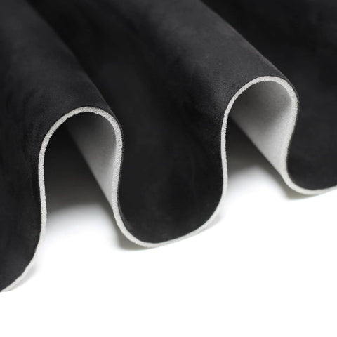 Suede headliner fabric with foam backing in black; close-up view