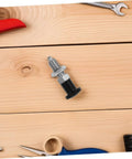 Built Damn Tough Stainless Steel Self Locking Indexing Plunger With Slick Spring Return Knob on wooden workbench.
