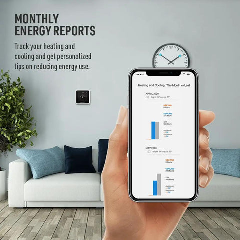 Person holding smartphone displaying energy reports in front of sofa, T5 WiFi Smart Thermostat on wall behind, Tuesday vibe.