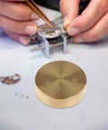 Pro Grade Copper Watch Oil Dispenser Kit With Oiler Cup 8cm for Horology Repair, shown on a watchmaker's desk