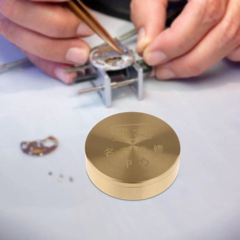 Pro Grade Copper Watch Oil Dispenser Kit With Oiler Cup 8cm for Horology Repair, shown on a watchmaker's desk