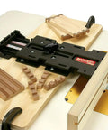 Must Have Jig With Fence System For Box Joints And Dovetails Includes Joint Templates And Instructional DVD Works With Routers And More Machines shown on workbench with templates