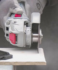 Heavy Duty Quick Change Adapter Links Threaded Blades Directly for Rock Solid Grinding, with angle grinder and steel disc in use.