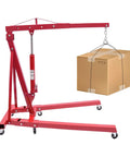 Premium Heavy Duty 1 Ton Folding Hydraulic Engine Hoist Shop Crane With Wheels lifting a cardboard box in a workshop.