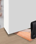 Set Of 4 Wooden Door Stoppers With Non Slip Anti Skid Pads shown under a door holding it open