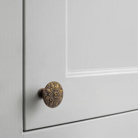 Six Pack Antique Brass Cabinet Knobs Featuring Intricate Vintage Mandala Design Ideal For Dressers Cabinets And Drawers Great For Restoring Antique Furniture And Creating Classic Farmhouse Style on gray cabinet door