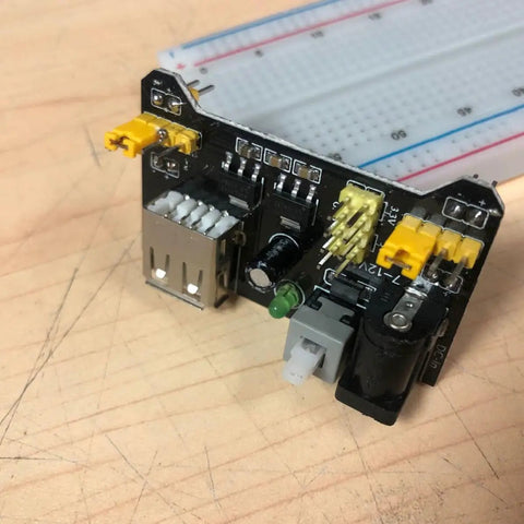 Six Pack DC Breadboard Power Supply Module 6.5 to 12V Input, Stable 3.3V and 5V Outputs, Portable and Plug and Play, Easy to Install, Fits MB102 Breadboard for Makers, Classrooms, Labs, and Industry Projects on breadboard