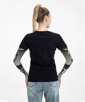Steampunk Bull Skull With Gears And Mechanical Accent Adult Cooling Arm Sleeves featuring thumbhole grip on model's arms from behind.