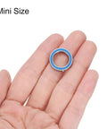 6701-2RS Miniature Deep Groove Ball Bearing 12x18x4mm held in hand, blue shield, stainless steel, for electric motors and machinery