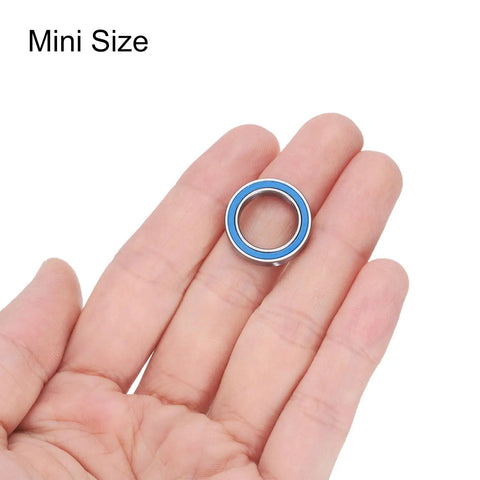 6701-2RS Miniature Deep Groove Ball Bearing 12x18x4mm held in hand, blue shield, stainless steel, for electric motors and machinery