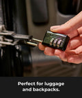 Master Lock black combination padlock with four-number dials, close-up view on a locker.