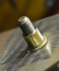 Close-up of a carbon steel rivet nut inserted into metal, part of the Rivet Nuts Assortment Kit 500 Pieces Carbon Steel M3 M4 M5 M6 M8 M10.