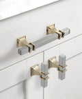 10 Pack 3 Inch Cabinet Handles In Brushed Nickel And Gold Finish installed on white cabinets, showing details of satin nickel and gold pulls.