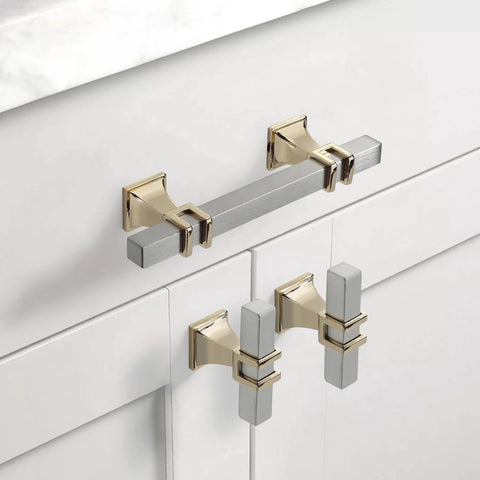 10 Pack 3 Inch Cabinet Handles In Brushed Nickel And Gold Finish installed on white cabinets, showing details of satin nickel and gold pulls.