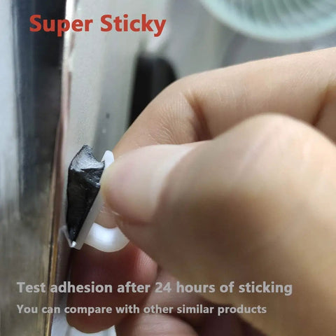 Hand applying 40 Pack Cable Clips With Strong Adhesive Tape For Wire Organization And Cord Management In Car, Office, And Home White Upgraded Nylon Clips for adhesion test.