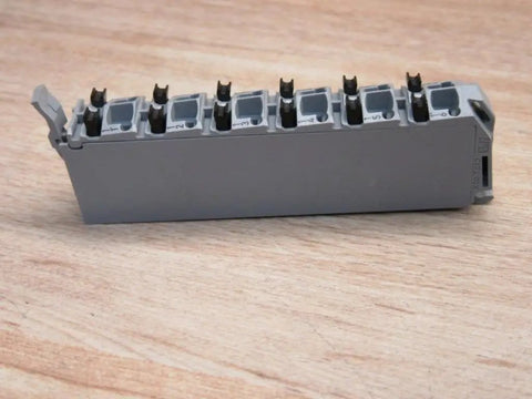 X20 12 Pin Terminal Block With Push In Connectors 10 Amp Heavy Duty Industrial Panel Wiring, grey housing on wooden surface.